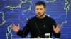 Президент України Володимир Зеленський (на екрані) під час відеозвернення до учасників засідання Європейської ради, яка пізніше проголосувала за початок переговорів про вступ до ЄС України. Брюссель, 14 грудня 2023 року