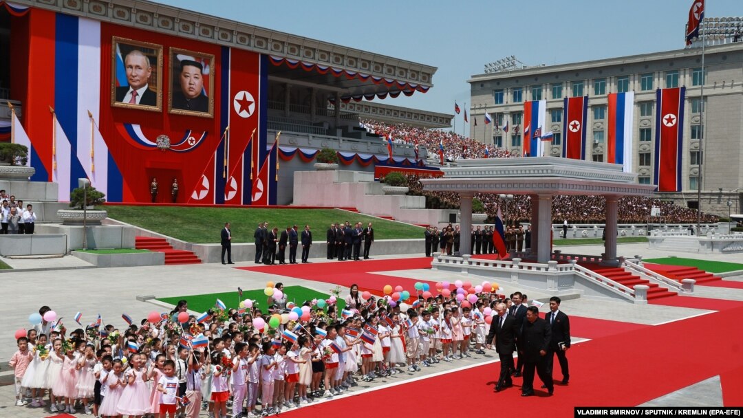 Russian President Vladimir Putin and North Korean leader Kim Jong Un attend an official welcoming ceremony during their meeting in Pyongyang on June 19.