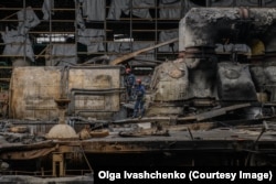 Emergency workers pick through Kharkiv’s heavily damaged thermal power plant after it was hit by a Russian missile in March.
