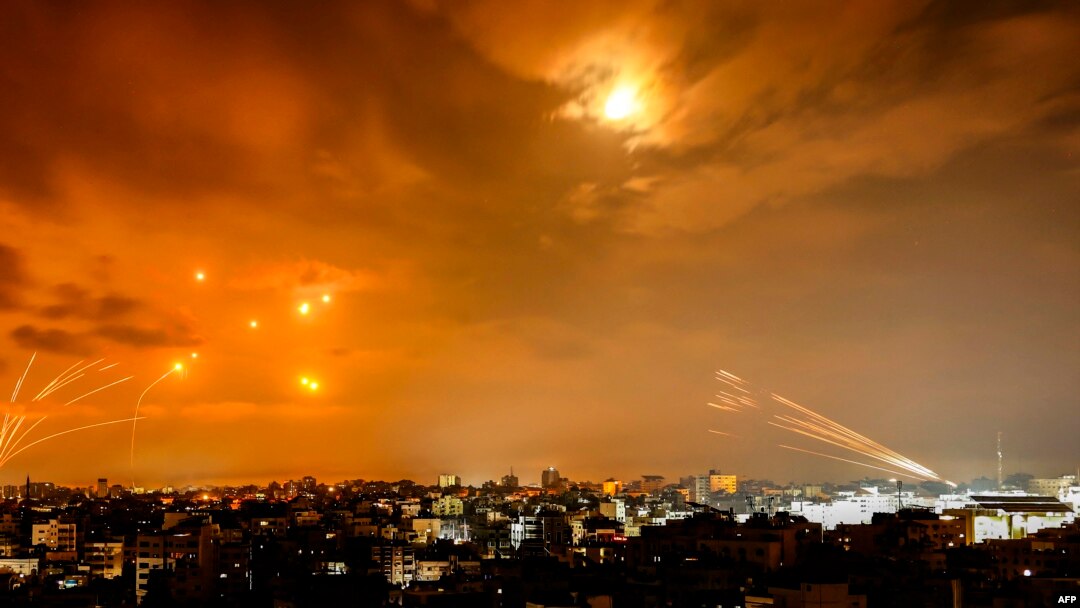 Rockets fired by Palestinian militants from Gaza City are intercepted by the Israeli Iron Dome defense system in the early hours of October 8.