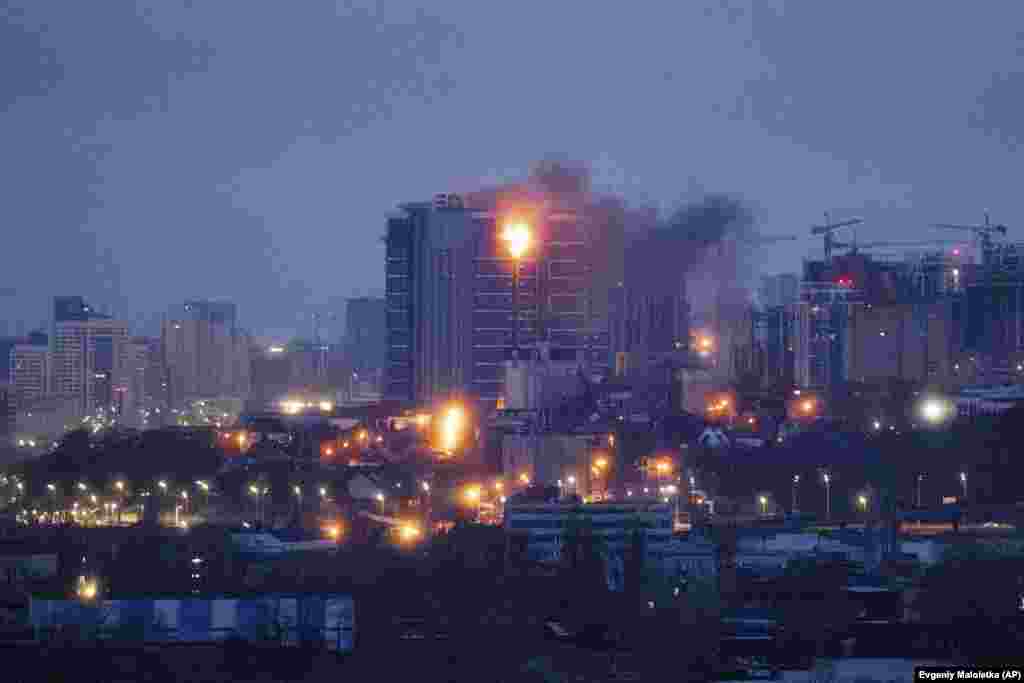 A view of the upper floor of a residential building ablaze after a Russian missile attack on Kyiv on January 2. Ukrainian President Volodymyr Zelenskiy said at least five people were killed and scores injured in a barrage of missiles and drones fired by Moscow's military on January 2 that Kyiv said was similar in scale to a massive Russian attack just days earlier.