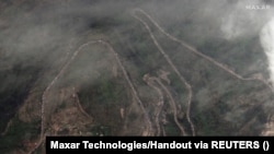 A satellite image shows a long traffic jam of vehicles along the Lachin corridor as ethnic Armenians flee from Nagorno-Karabakh, September 26, 2023.