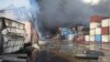 Containers burn on April 27 at the site of a massive explosion and fire that rocked a port near the southern port city of Bandar Abbas, Iran.
