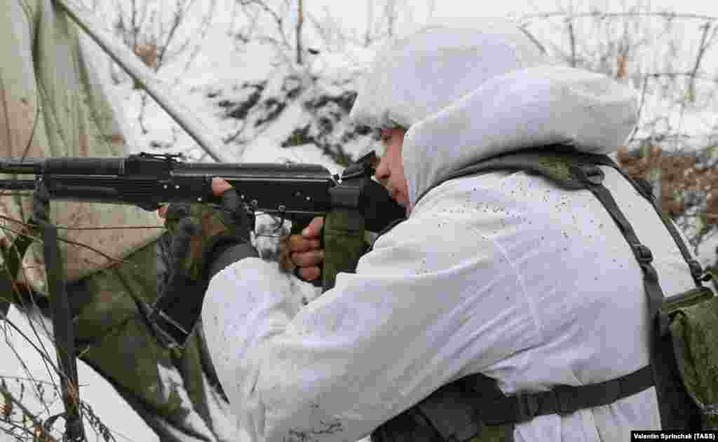 A fighter of the so-called Luhansk People's Militia watches the front line facing Ukrainian positions near Slavyanoserbsk on January 25. 