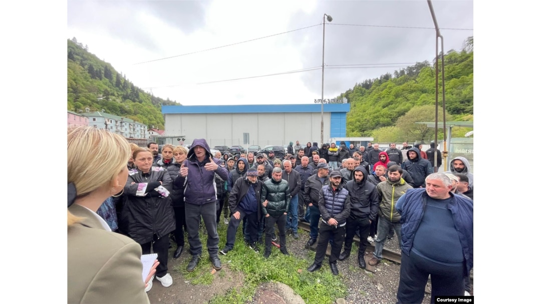 Workers gather outside of one of Borjomi’s two bottling plants on May 30.