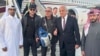 US citizen George Glezmann (center) poses with Adam Boehler (second left) and Zalmay Khalilzad (second right) and Qatari diplomats in Kabul, Afghanistan, Thursday, March 20, 2025, before departing to Doha, Qatar.