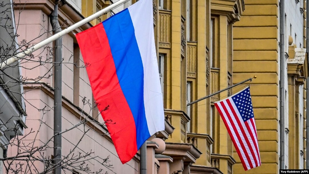 A Russian flag hangs at a building next to the U.S. Embassy in Moscow. (file photo)