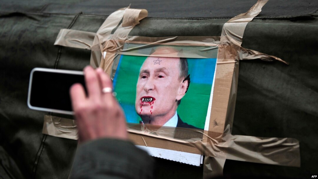 Russian President Vladimir Putin's snarling visage has become the main target for caricatures and cartoons. 