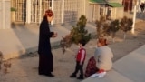Turkmenistan. Two women with the kids are chatting in one of the neighborhoods of Ashgabat. January, 2025. mother, mothers, children, kids