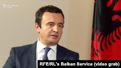 Kosovar politician Albin Kurti often likes to display Albanian nationalist symbols at interviews and other events. (file photo)