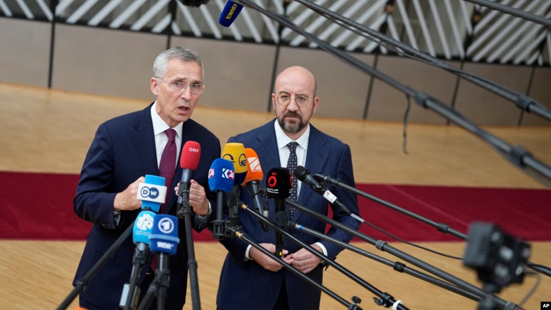 NATO Secretary-General Jens Stoltenberg (left) and European Council President Charles Michel speak with the media as they arrive for the EU summit in Brussels on June 29, with the Ukraine war top of the agenda.