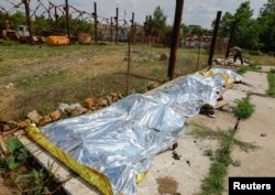 Обгорілі тіла загиблих українських бійців після теракту в колонії Оленівки, 29 липня 2022 рік