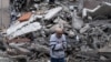 A man walks amid the rubble of a building on May 8 after a Russia air strike on Kostyantynivka. 