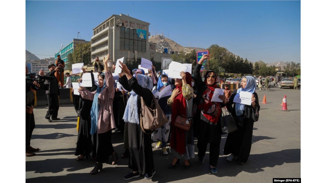 A group of Afghan women shout slogans during a protest in Kabul on October 21.