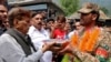 People present sweets to Pakistan Army soldiers as part of celebrations following the announcement of a cease-fire between India and Pakistan, in Chakothi village in Pakistan-administered Kashmir on May 11. 