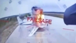 A Russian military aircraft is seen burning on video footage from a Ukrainian drone attacking the Belaya air base, near Russia's border with Mongolia.