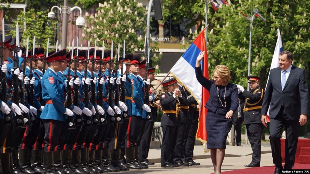 Valentina Matviyenko, speaker of the Federation Council, Russian parliament's upper chamber (center) reviews an honor guard with Milorad Dodik, president of Republic Srpska