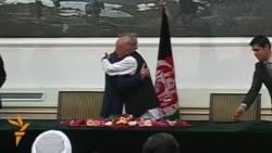 Afghan Rival Candidates Sign Power-Sharing Deal