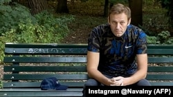 Aleksei Navalny sits on a bench in Berlin after being released from the hospital on September 23.