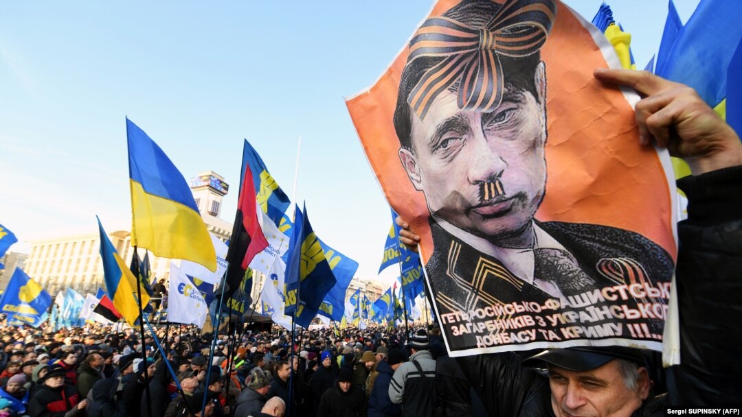 Плакат із зображенням президента Росії Володимира Путіна під час акції «Червоні лінії для Зе». Київ, 8 грудня 2019 року 