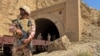 Pakistani soldiers stand at a tunnel where a train was attacked by separatist militants in Balochistan on March 15. Pakistan's border regions near Afghanistan have seen an uptick in insurgent violence in recent years. 