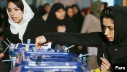 Iran -- An Iranian girl casts her vote in tenth presidential election on 11Jun2009.