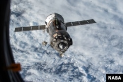 A Soyuz spacecraft carrying Virts and Shkaplerov back to Earth after undocking from the ISS in June 2015