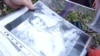 Vladyslav Popovych's mother shows Current Time a photo of her son. He is still in prison in Russia, three years after being taken by Russian troops in the Ukrainian city of Bucha. 