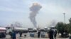 A plume of smoke rises from the site of an explosion at the Iranian port city of Bandar Abbas on April 26.