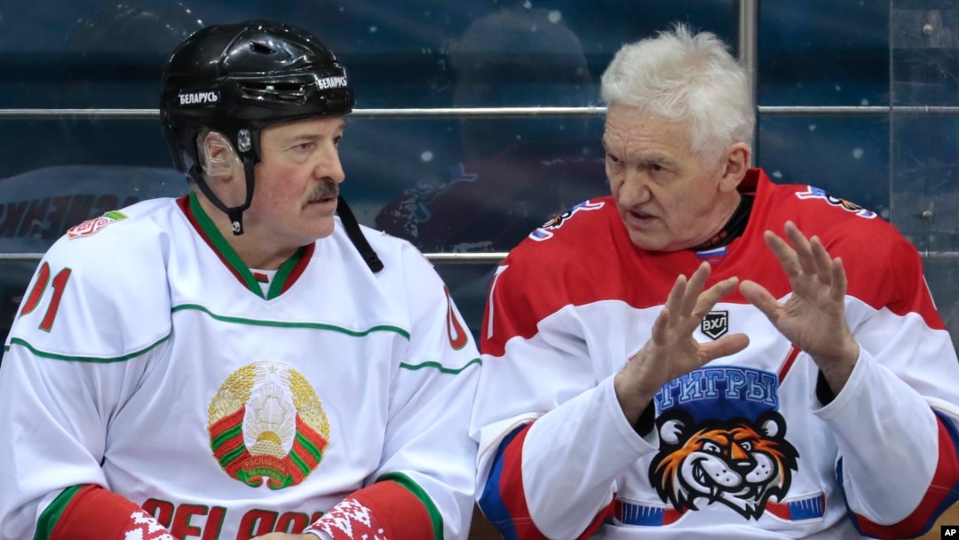 Russian oligarch Gennady Timchenko (right) speaks with Belarusian strongman Alyaksandr Lukashenka during an ice hockey game at Shayba Arena in Sochi, Russia, in 2019. 