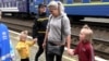 Kateryna and her children arrive in Mukachevo, western Ukraine, with the help of the Proliska humanitarian group.