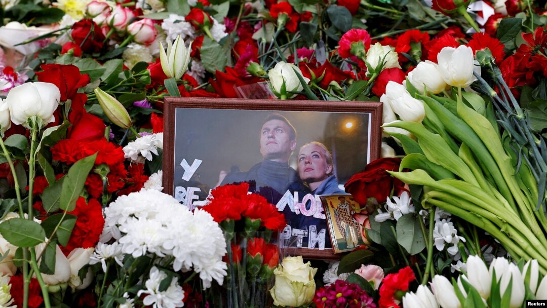 A photograph of Russian opposition politician Aleksei Navalny and his wife Yulia is placed amid flowers on his grave following his funeral at the Borisovskoye cemetery in Moscow on March 2. 