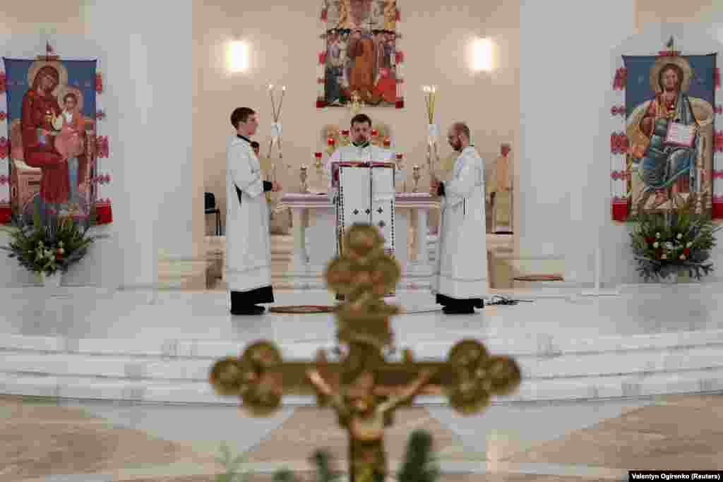 Clerics in Kyiv's Cathedral of the Resurrection of Christ hold a service on January 26 after Pope Francis called for a "prayer for peace" amid the ongoing tensions over a massive Russian military buildup around the borders of Ukraine. 