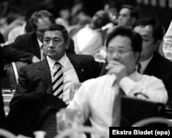 As he grew richer following Uzbekistan's independence in 1991, Rakhimov (left) -- shown here in Ankara in 1998 -- exerted his influence in Uzbekistan's state-run sports sector through his sponsorship of boxing, wrestling, martial arts, and weightlifting.