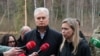 Lithuanian President Gitanas Nauseda (left) speaks to the media next to U.S. Ambassador to Lithuania Kara C. McDonald at the site of a rescue operation at the Pabrade training ground.
