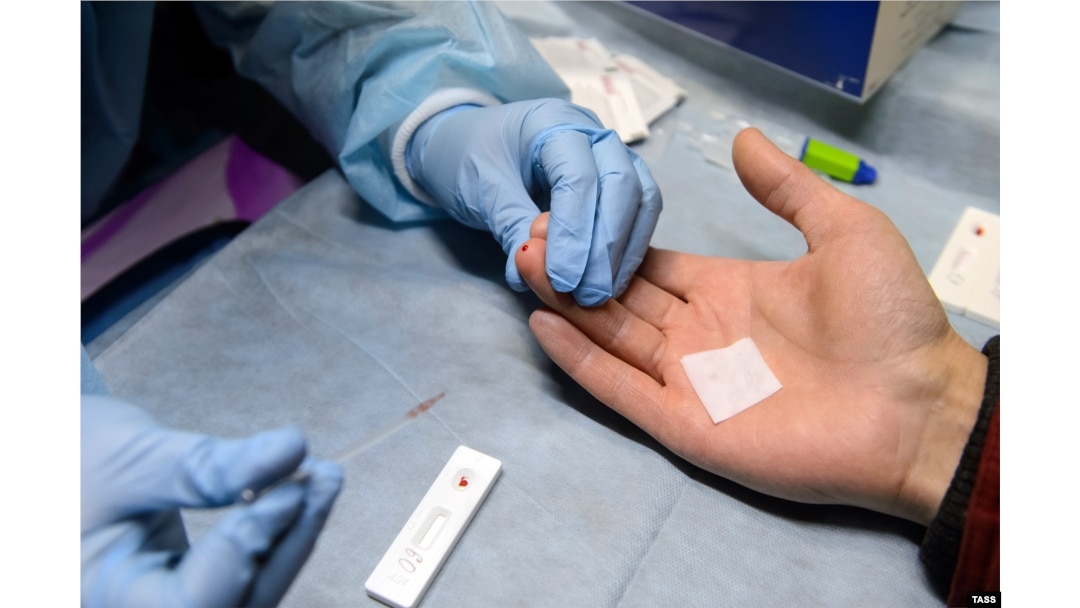 A patient is examined at a mobile HIV testing unit in Yekaterinburg in 2016.