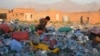 An Afghan child works in a plastic recycling factory on the outskirts of Mazar-i-Sharif. 