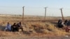 Афганские военнослужащие, отступившие на таджикскую территорию после сражения с талибами