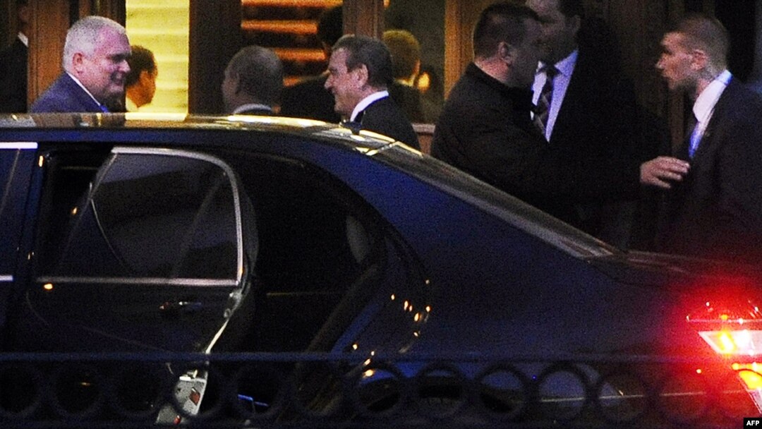 Former German Chancellor Gerhard Schroeder (center) speaks with Russian President Vladimir Putin (2nd left) and Nord Stream AG Managing Director Matthias Warnig (left) at the entrance to the Yuspovsky Palace in St. Petersburg on April 28.