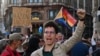 <p>A Hungarian protester shouts an anti-government slogan during a demonstration close to the Erzsebet Bridge in central Budapest. 