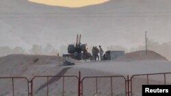 Iranski vojnici na straži u nuklearnom postrojenju u Isfahanu 19. aprila, 2024.