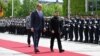 German Chancellor Friedrich Merz walks with Ukrainian President Volodymyr Zelenskiy at the Chancellery in Berlin on May 28.