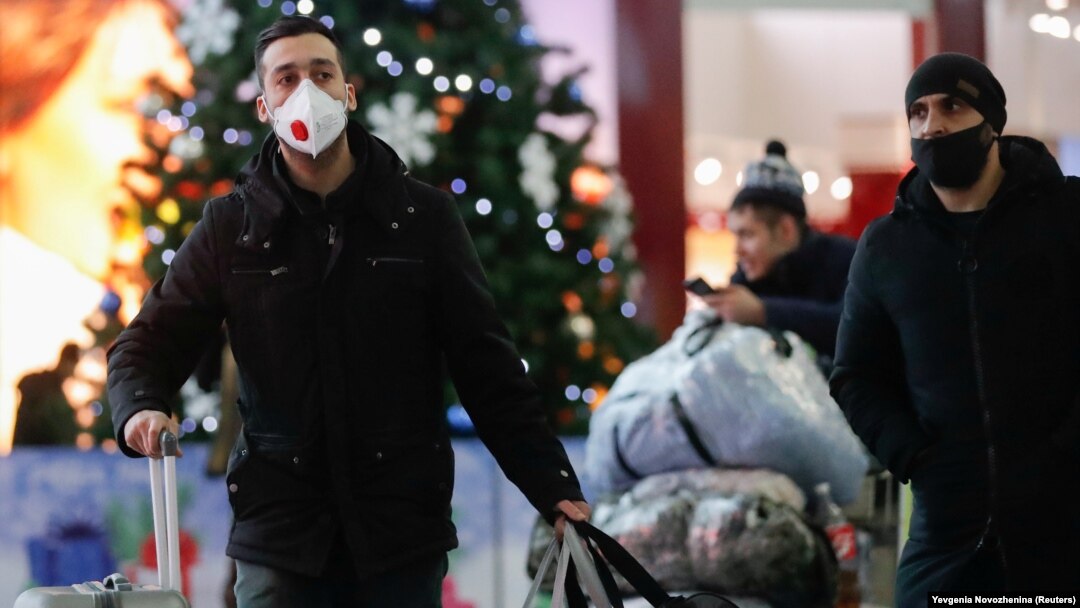 People arrive at the departure zone of Vnukovo International Airport in Moscow.
