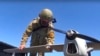 Російський військовослужбовець біля розвідувального безпілотника «Орлан-10»